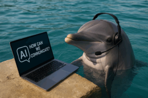 A dolphin wearing a headset next to a laptop, representing the idea: Can AI help us talk to animals?